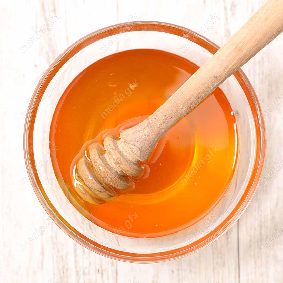 عکس با کیفیت عسل طبیعی در ظرف شیشه ای MJ002275