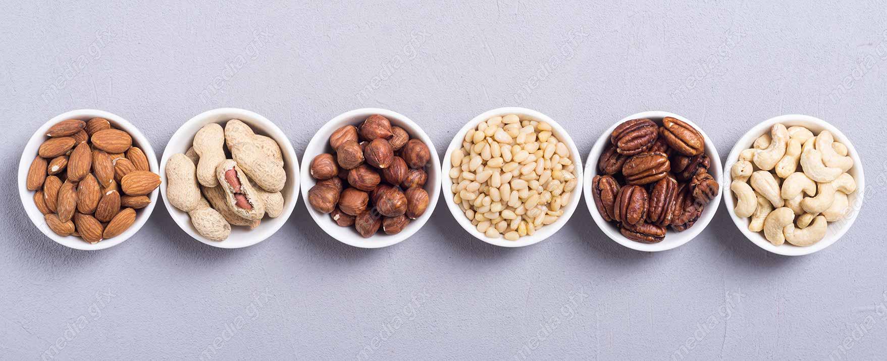 عکس با کیفیت پس زمینه انواع آجیل مغز در ظرف های متنوع  MJ004184